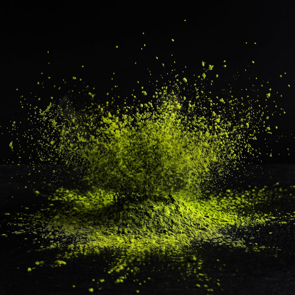 A dramatic burst of bright neon yellow-green powder or pigment splashing and settling against a solid black background.