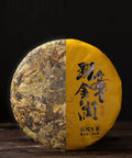 Ban Zhang Golden Liqueur, 2020 – Sheng Pu-Erh Kuchen, halb unverpackt, halb im Wrapper