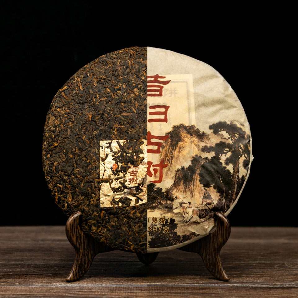 Sigui, 2009 – Shou Pu-Erh Kuchen, halb unverpackt, halb im Wrapper