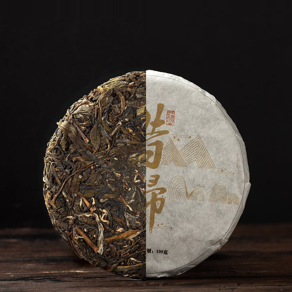 Xi Gui Gu Shu, 2021 – Sheng Pu-Erh Kuchen, halb unverpackt, halb im Wrapper